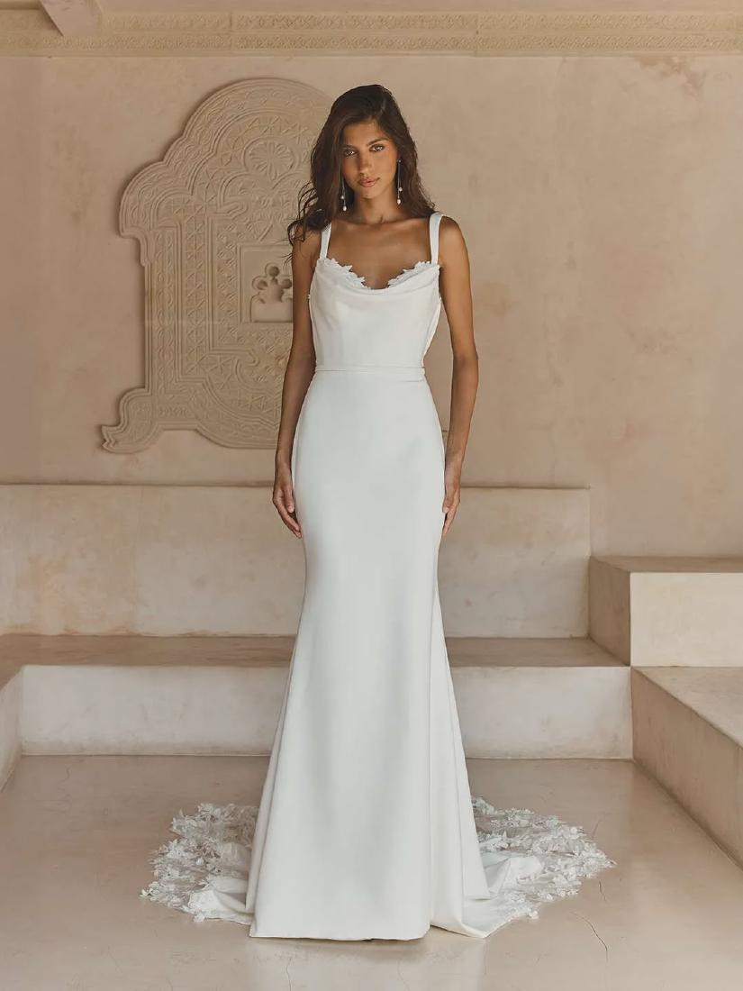 Chris standing up holding his daughter Elva