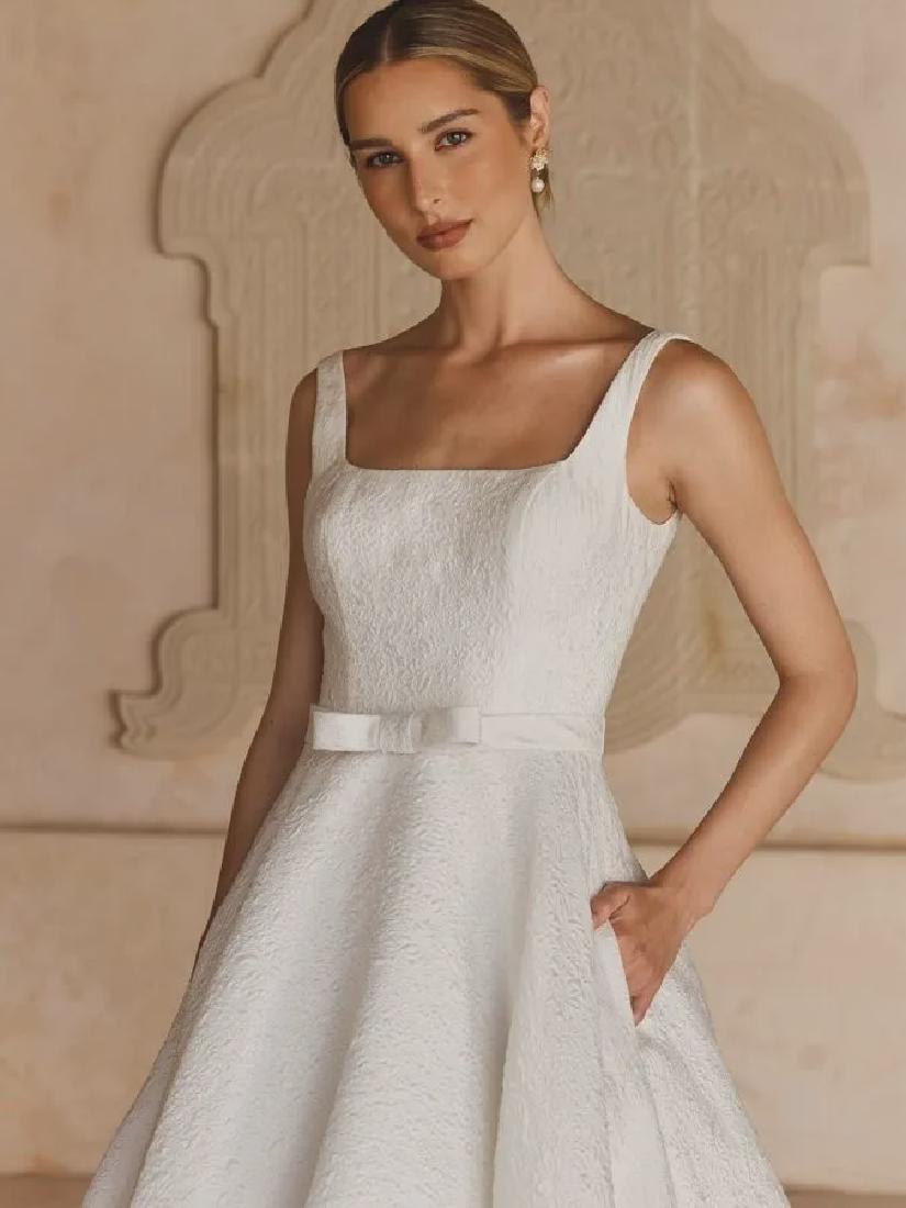 Chris standing up holding his daughter Elva