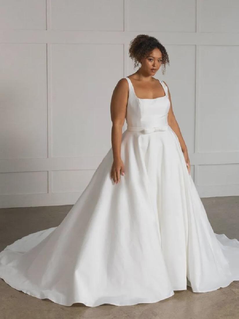 Chris standing up holding his daughter Elva